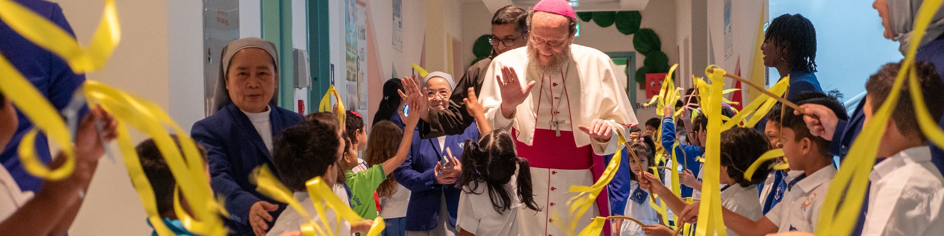 Bishop Paolo greeted by school children