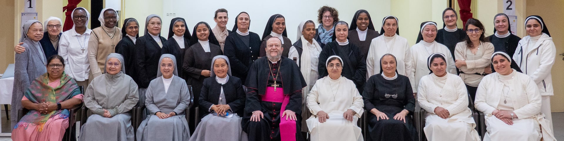 Bishop Paolo with religious sisters serving in the Vicariate